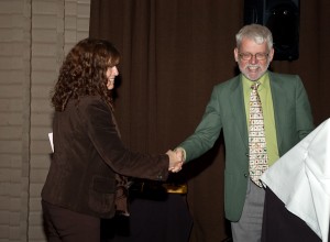 Past-President Dr. Gary Umphrey passing the Roach & Gavel to President Dr. Hannah Fraser