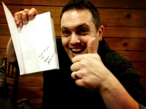 Glendon Mellow (@FlyingTrilobite) showing off a special ScienceOnline signed copy.